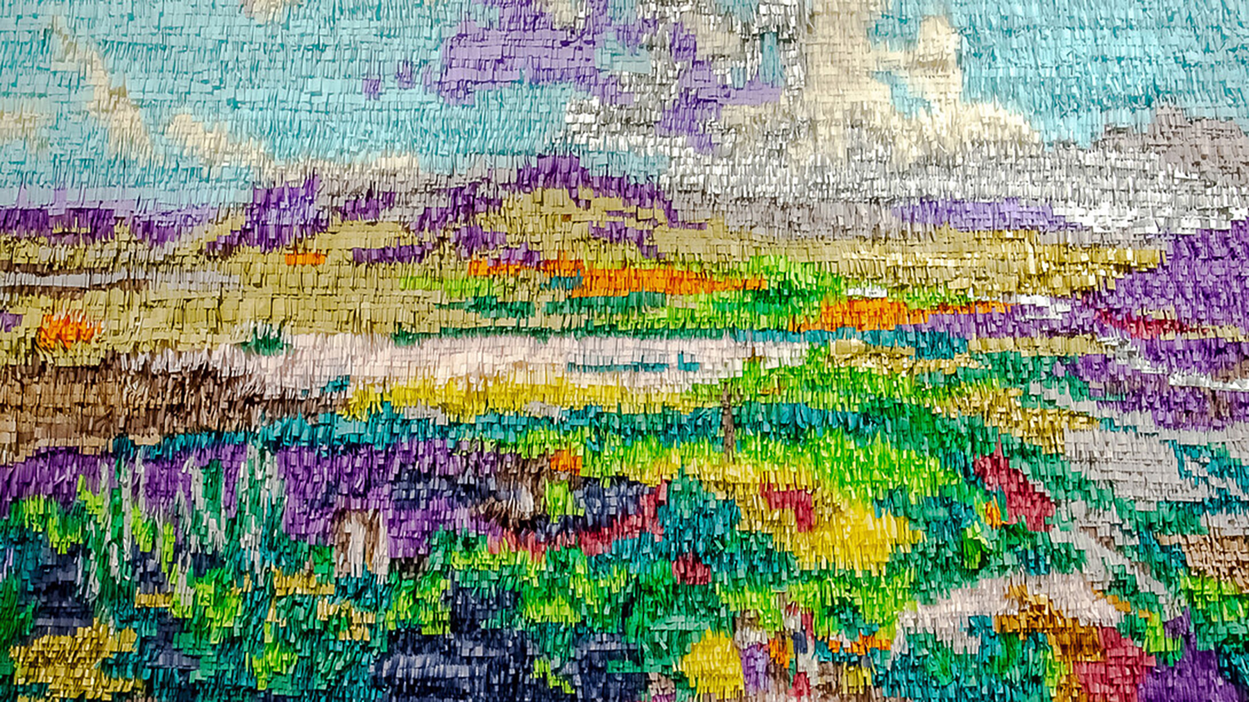 A landscape made of tissue paper using the same techniques as one would use to create a pinata.